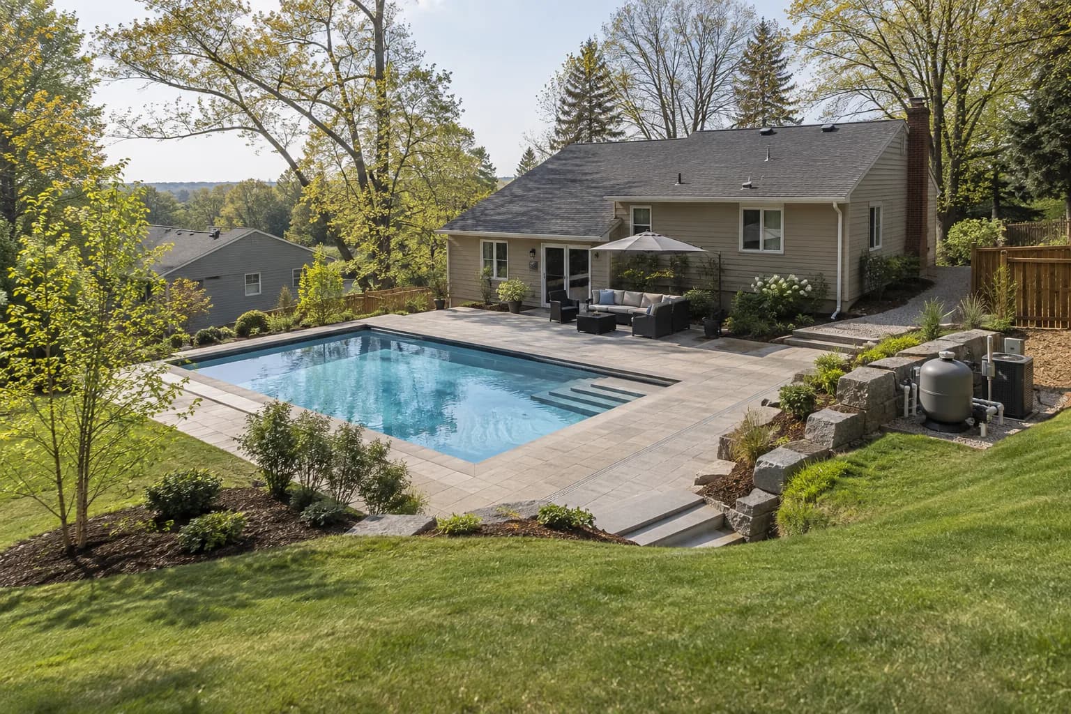 Illustrative sloped-site pool, drainage, access, and landscaping concept for Atchison, KS